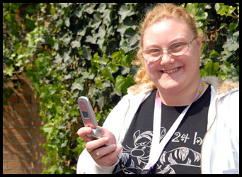 Young adult holding a mobile phone
